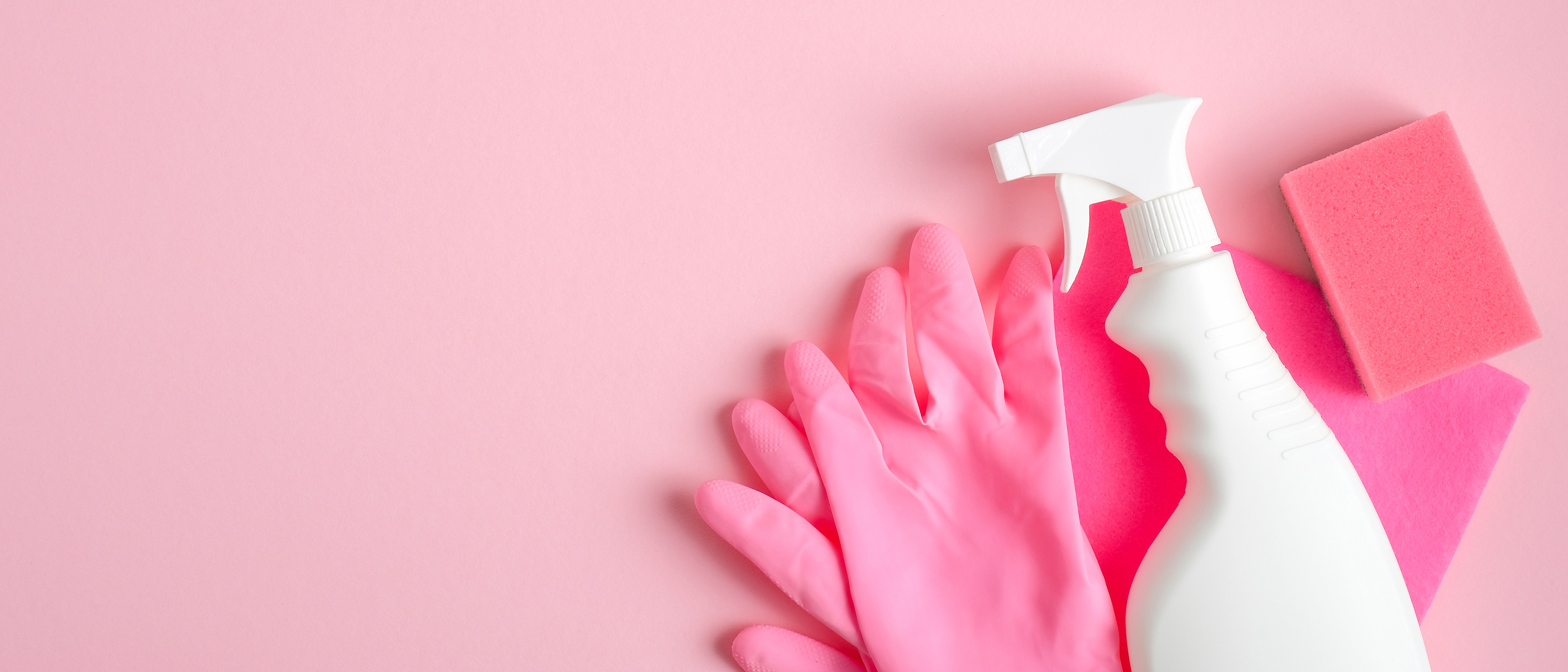 Cleaning Supplies on Pink Background